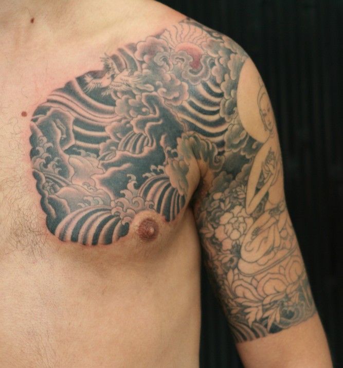 buddha half sleeve and chest tattoo in progress