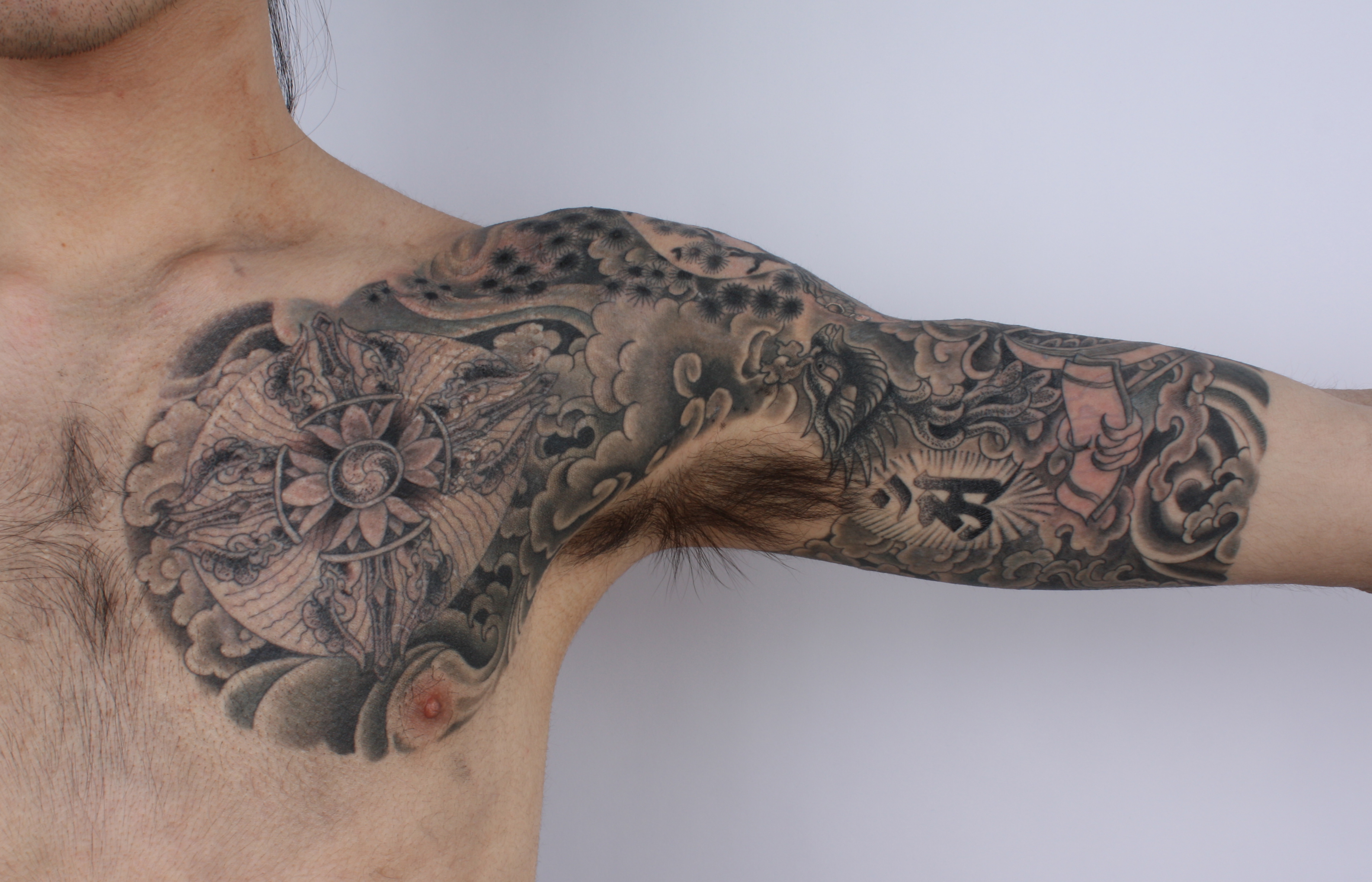 a rib tattoo back shoulder