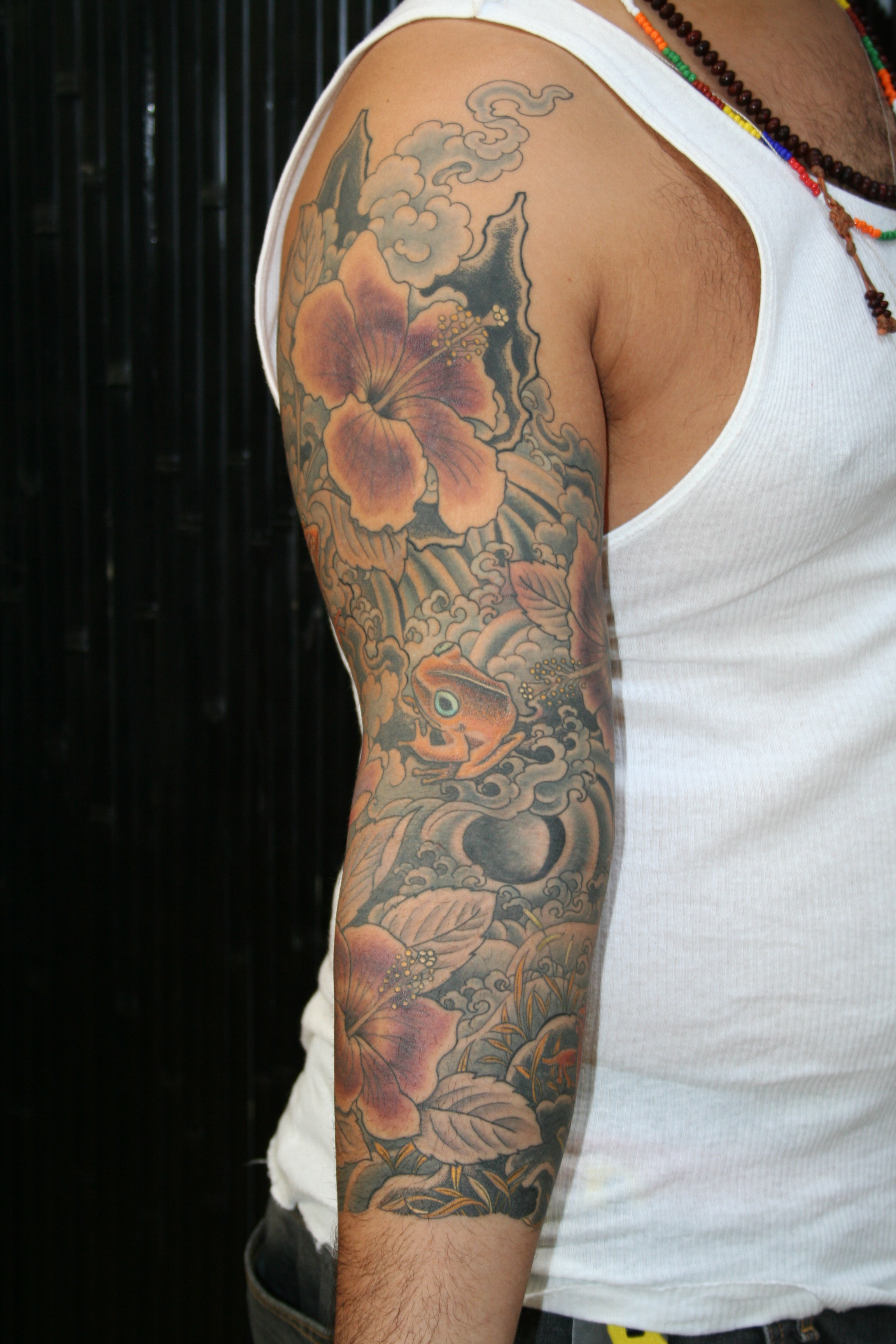 frogs and hibiscus tattoo